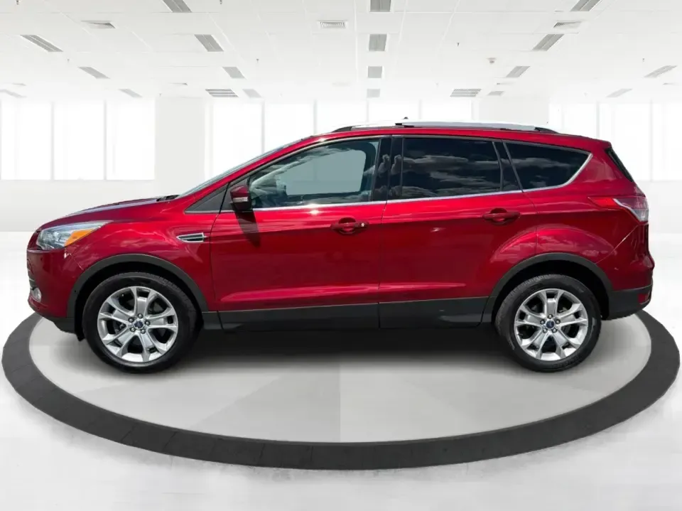 2014 Ford Escape Titanium 4WD (1FMCU9J91EU) with an 2.0L L4 DOHC 16V engine, 6-Speed Automatic transmission, located at 1099 N County Rd 25A, Troy, OH, 45373, (937) 908-9800, 40.057079, -84.212883 - Weekend getaways to Hocking Hills, snowy commutes up I75, or the everyday school-and-grocery loop around Troy-this 2014 Ford Escape Titanium 4WD is built for the kind of life that doesn't slow down when the weather changes. With seating for five, flexible cargo space, and confident four-wheel drive,- Photo#5
