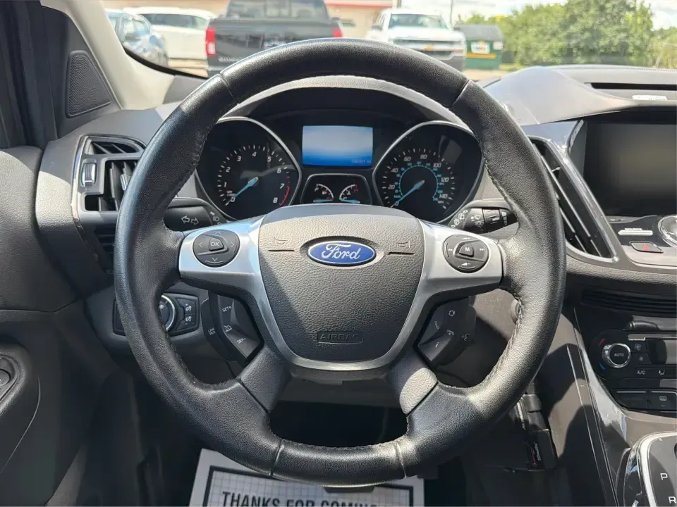 2014 Ford Escape Titanium 4WD (1FMCU9J91EU) with an 2.0L L4 DOHC 16V engine, 6-Speed Automatic transmission, located at 1099 N County Rd 25A, Troy, OH, 45373, (937) 908-9800, 40.057079, -84.212883 - Weekend getaways to Hocking Hills, snowy commutes up I75, or the everyday school-and-grocery loop around Troy-this 2014 Ford Escape Titanium 4WD is built for the kind of life that doesn't slow down when the weather changes. With seating for five, flexible cargo space, and confident four-wheel drive,- Photo#16