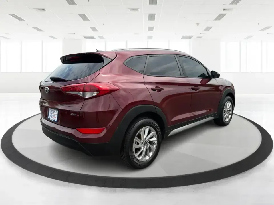 2017 Hyundai Tucson SE w/Preferred Package AWD (KM8J3CA42HU) with an 2.0L L4 DOHC 16V engine, 6A transmission, located at 1230 East Main St, Xenia, OH, 45385, (937) 908-9800, 39.688026, -83.910172 - Weekend getaways to John Bryan State Park, snowy school runs, and daily commutes down US-35 all ask for the same thing: a compact SUV that feels confident, comfortable, and ready for real life. This 2017 Hyundai Tucson SE w/Preferred Package AWD in Ruby Wine is a practical choice for drivers who wan- Photo#2