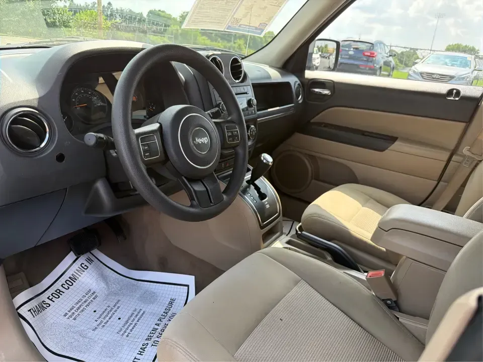 2015 Jeep Patriot Sport 4WD (1C4NJRBB1FD) with an 2.4L L4 DOHC 16V engine, located at 1184 Kauffman Ave, Fairborn, OH, 45324, (937) 908-9800, 39.807072, -84.030914 - Weekend lake days at Huffman Prairie, snowy commutes to Wright-Patterson AFB, or a packed-backseat run to The Greene-this 2015 Jeep Patriot Sport 4WD is built for Fairborn life when you want SUV versatility without giving up everyday practicality. With confident four-wheel drive and a manageable siz- Photo#9