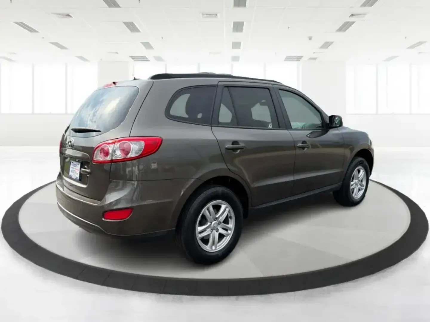 2012 Hyundai Santa Fe GLS 2.4 FWD (5XYZG3AB8CG) with an 2.4L L4 DOHC 16V engine, 6-Speed Automatic transmission, located at 8750 N County Rd 25A, Piqua, OH, 45356, (937) 908-9800, 40.164391, -84.232513 - Picture an easy weekend getaway: you load the cooler, fold the second-row seats for extra gear, and head out of Piqua toward Indian Lake or a day trip through the Miami Valley-without needing a giant SUV. This 2012 Hyundai Santa Fe GLS 2.4 is a practical, five-passenger SUV that fits real life, whet- Photo#2