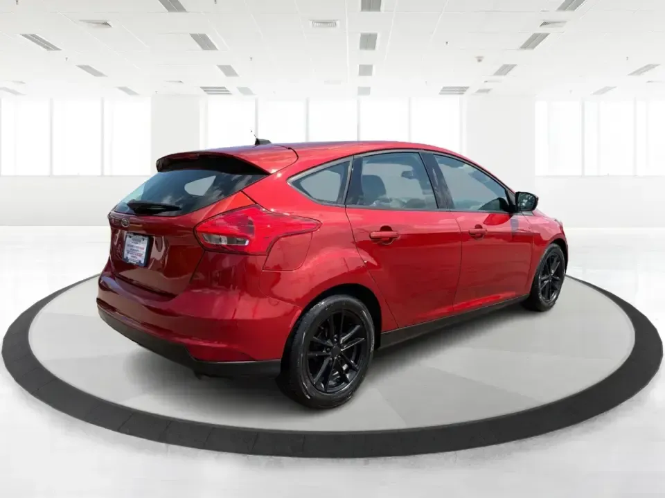 2018 Ford Focus SE (1FADP3K27JL) with an 2L I-4 gasoline direct injection engine, Automatic transmission, located at 401 Woodman Dr, Riverside, OH, 45431, (937) 908-9800, 39.760899, -84.123421 - Need a smart, efficient ride for the daily commute, campus runs, or quick weekend getaways around the Miami Valley? This 2018 Ford Focus SE in eye-catching Hot Pepper Red Metallic Tinted Clearcoat is a practical hatchback-style choice that fits real life-easy to park in busy lots, comfortable for fi- Photo#2