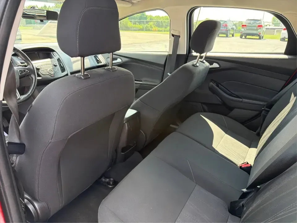 2018 Ford Focus SE (1FADP3K27JL) with an 2L I-4 gasoline direct injection engine, Automatic transmission, located at 401 Woodman Dr, Riverside, OH, 45431, (937) 908-9800, 39.760899, -84.123421 - Need a smart, efficient ride for the daily commute, campus runs, or quick weekend getaways around the Miami Valley? This 2018 Ford Focus SE in eye-catching Hot Pepper Red Metallic Tinted Clearcoat is a practical hatchback-style choice that fits real life-easy to park in busy lots, comfortable for fi- Photo#10