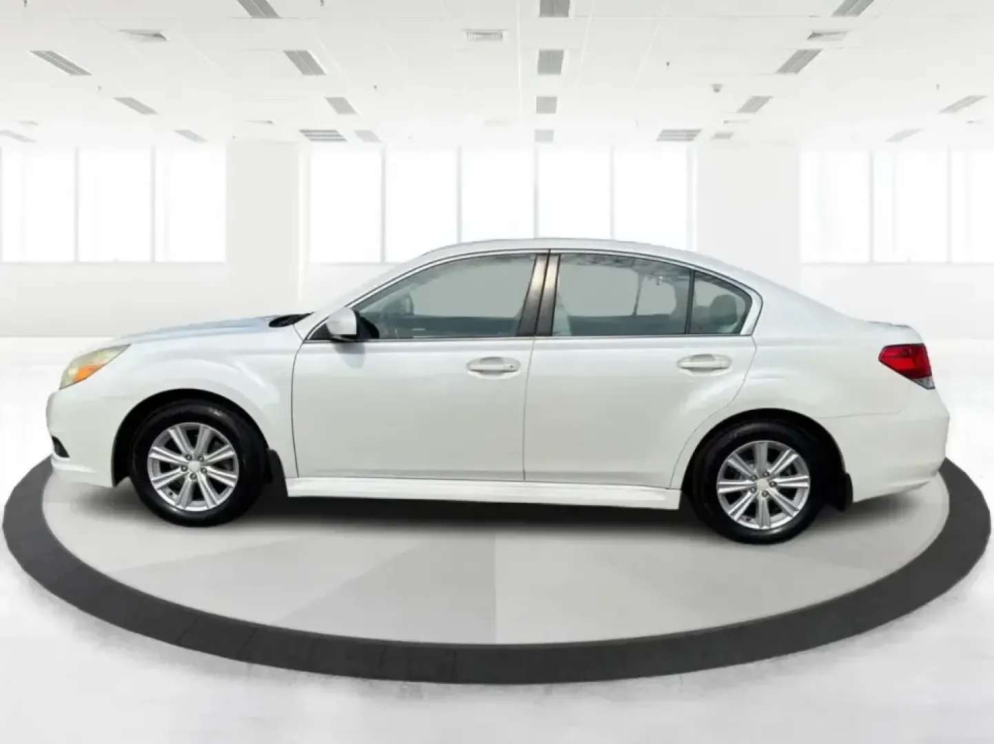 2011 Subaru Legacy Premium + CWP (4S3BMBC69B3) with an 2.5L H-4 variable valve control engine, Continuously Variable Transmission (CVT) transmission, located at 8750 N County Rd 25A, Piqua, OH, 45356, (937) 908-9800, 40.164391, -84.232513 - Need a confident, all-weather commuter that can handle Ohio winters, weekend road trips, and the daily school-and-work shuffle without feeling like a bare-bones sedan? This 2011 Subaru Legacy Premium + CWP in Satin White Pearl is a smart fit for drivers who want Subaru capability in a comfortable, p- Photo#5