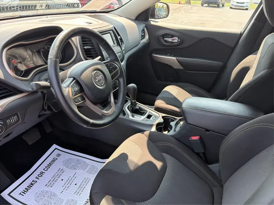 2017 Jeep Cherokee Latitude (1C4PJLCB5HW) with an 2.4L L4 DOHC 16V engine, 9-Speed Automatic transmission, located at 401 Woodman Dr, Riverside, OH, 45431, (937) 908-9800, 39.760899, -84.123421 - Need a crossover that fits real life in the Miami Valley-school drop-offs, I675 commutes, grocery runs, and the occasional weekend escape to Carillon Historical Park or a hike near the Mad River? This 2017 Jeep Cherokee Latitude FWD in Deep Cherry Red Crystal Pearlcoat is built for everyday versatil- Photo#9