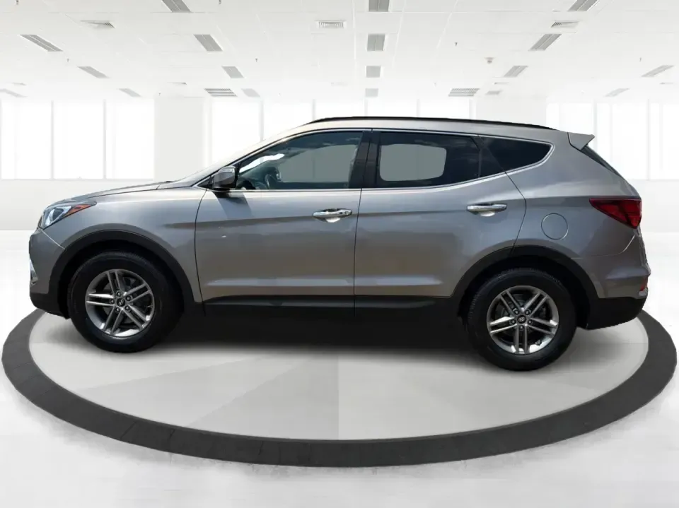 2017 Hyundai Santa Fe Sport 2.4 FWD (5XYZU3LBXHG) with an 2.4L L4 DOHC 16V engine, 6-Speed Automatic transmission, located at 1099 N County Rd 25A, Troy, OH, 45373, (937) 908-9800, 40.057079, -84.212883 - Pack the kids for school drop-off, load up groceries for the week, and still have room for a spontaneous weekend escape-this 2017 Hyundai Santa Fe Sport is built for real life in Troy, Ohio. With SUV practicality, comfortable seating, and the kind of everyday tech that makes commuting smoother, it's- Photo#5