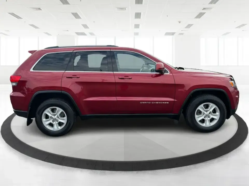 2014 Jeep Grand Cherokee Laredo 4WD (1C4RJFAG9EC) with an 3.6L V6 DOHC 24V engine, 5-Speed Automatic transmission, located at 1099 N County Rd 25A, Troy, OH, 45373, (937) 908-9800, 40.057079, -84.212883 - Picture your next Ohio weekend: the kids and gear loaded up, a cooler in the back, and you cruising out of Troy toward Charleston Falls Preserve or a fall drive through the Miami County countryside-confident that changing weather and back roads won't change your plans. This 2014 Jeep Grand Cherokee- Photo#1
