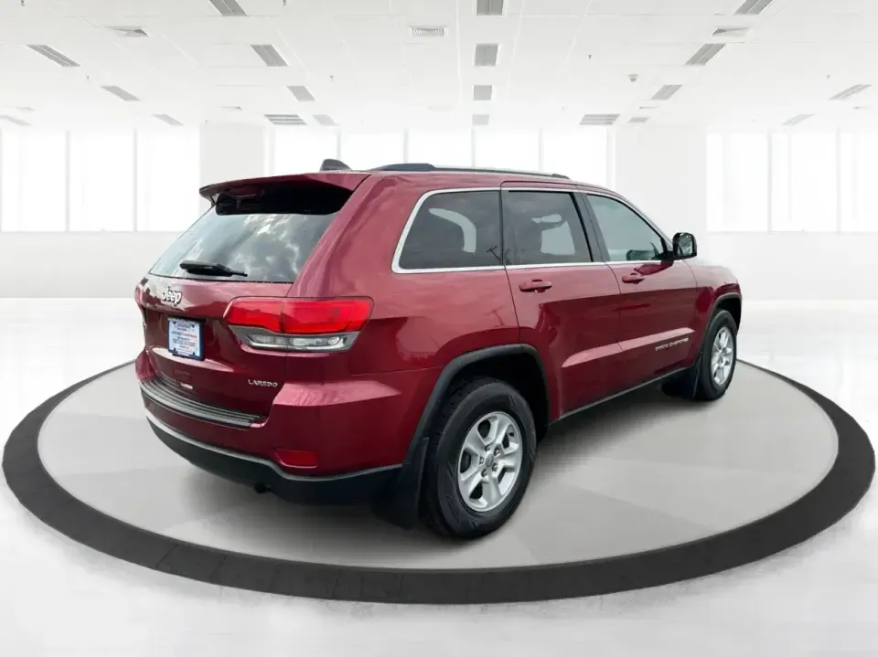 2014 Jeep Grand Cherokee Laredo 4WD (1C4RJFAG9EC) with an 3.6L V6 DOHC 24V engine, 5-Speed Automatic transmission, located at 1099 N County Rd 25A, Troy, OH, 45373, (937) 908-9800, 40.057079, -84.212883 - Picture your next Ohio weekend: the kids and gear loaded up, a cooler in the back, and you cruising out of Troy toward Charleston Falls Preserve or a fall drive through the Miami County countryside-confident that changing weather and back roads won't change your plans. This 2014 Jeep Grand Cherokee- Photo#2