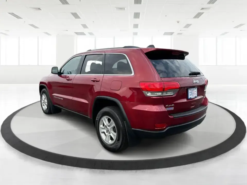 2014 Jeep Grand Cherokee Laredo 4WD (1C4RJFAG9EC) with an 3.6L V6 DOHC 24V engine, 5-Speed Automatic transmission, located at 1099 N County Rd 25A, Troy, OH, 45373, (937) 908-9800, 40.057079, -84.212883 - Picture your next Ohio weekend: the kids and gear loaded up, a cooler in the back, and you cruising out of Troy toward Charleston Falls Preserve or a fall drive through the Miami County countryside-confident that changing weather and back roads won't change your plans. This 2014 Jeep Grand Cherokee- Photo#4