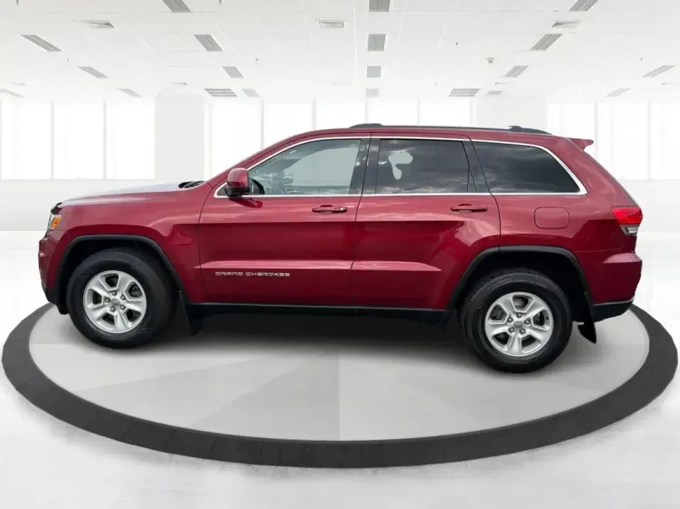 2014 Jeep Grand Cherokee Laredo 4WD (1C4RJFAG9EC) with an 3.6L V6 DOHC 24V engine, 5-Speed Automatic transmission, located at 1099 N County Rd 25A, Troy, OH, 45373, (937) 908-9800, 40.057079, -84.212883 - Picture your next Ohio weekend: the kids and gear loaded up, a cooler in the back, and you cruising out of Troy toward Charleston Falls Preserve or a fall drive through the Miami County countryside-confident that changing weather and back roads won't change your plans. This 2014 Jeep Grand Cherokee- Photo#5