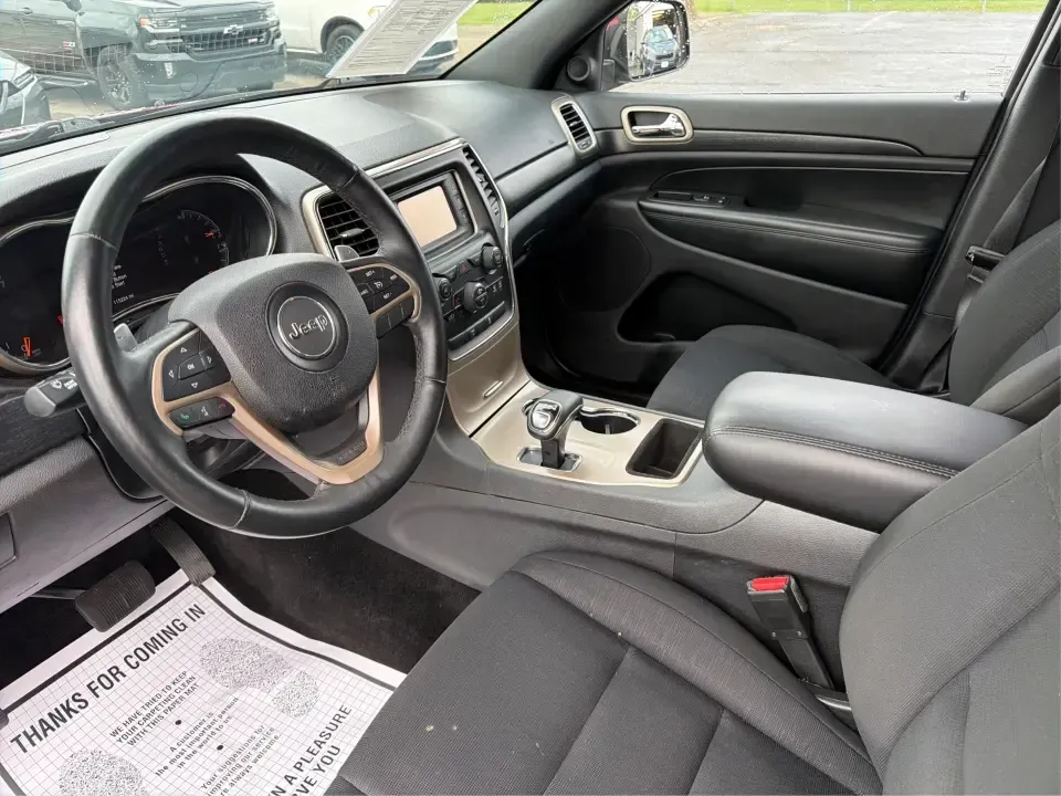 2014 Jeep Grand Cherokee Laredo 4WD (1C4RJFAG9EC) with an 3.6L V6 DOHC 24V engine, 5-Speed Automatic transmission, located at 1099 N County Rd 25A, Troy, OH, 45373, (937) 908-9800, 40.057079, -84.212883 - Picture your next Ohio weekend: the kids and gear loaded up, a cooler in the back, and you cruising out of Troy toward Charleston Falls Preserve or a fall drive through the Miami County countryside-confident that changing weather and back roads won't change your plans. This 2014 Jeep Grand Cherokee- Photo#9