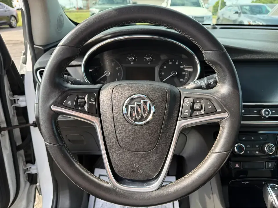 2018 Buick Encore Preferred FWD (KL4CJASB1JB) with an 1.4L L4 DOHC 16V TURBO engine, 6-Speed Automatic transmission, located at 8750 N County Rd 25A, Piqua, OH, 45356, (937) 908-9800, 40.164391, -84.232513 - Need a nimble SUV that fits real life in the Miami Valley-school drop-offs, a long commute down I75, and weekend errands without feeling bulky in tight parking lots? This 2018 Buick Encore Preferred FWD in Summit White is a smart pick for busy families, first-time buyers, and budget-conscious driver- Photo#16